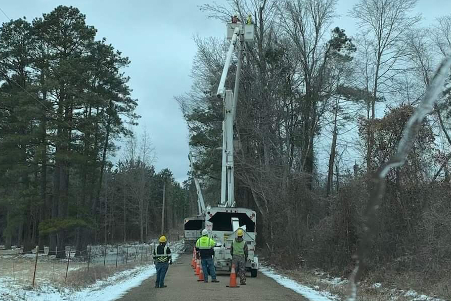 Vegetation crews trim limbs out of power lines in Helena.